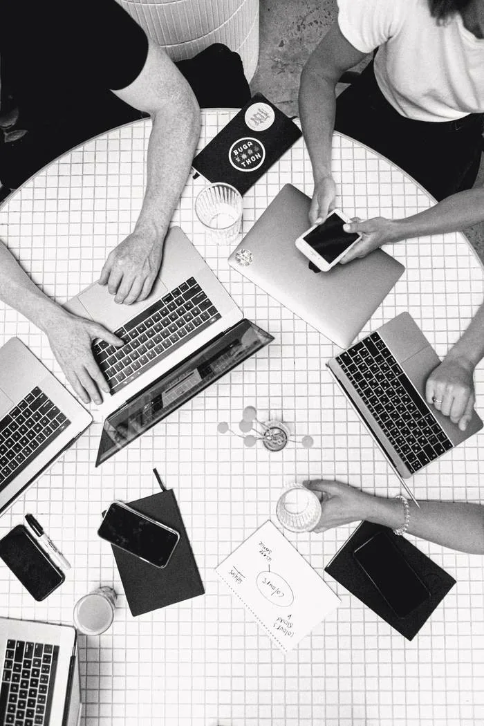 Marketing team collaborating across three service pillars